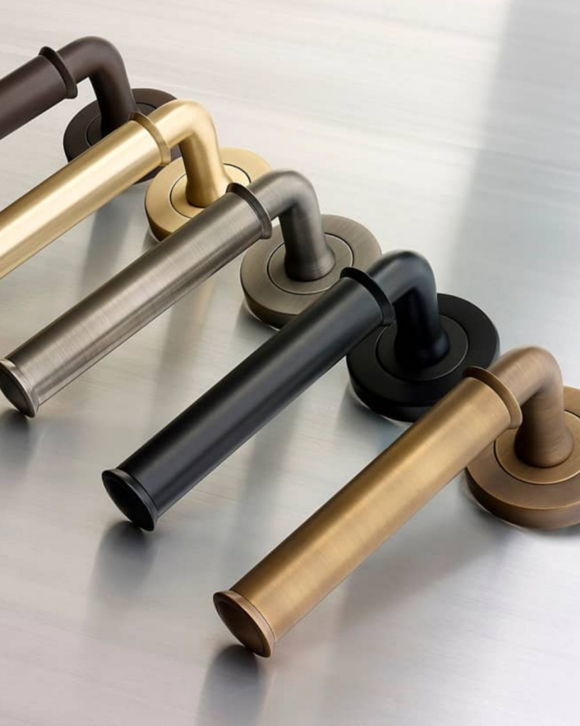 different finishes of door handles. black matte handle. graphite handle. gold brass handle. champagne bronze handle