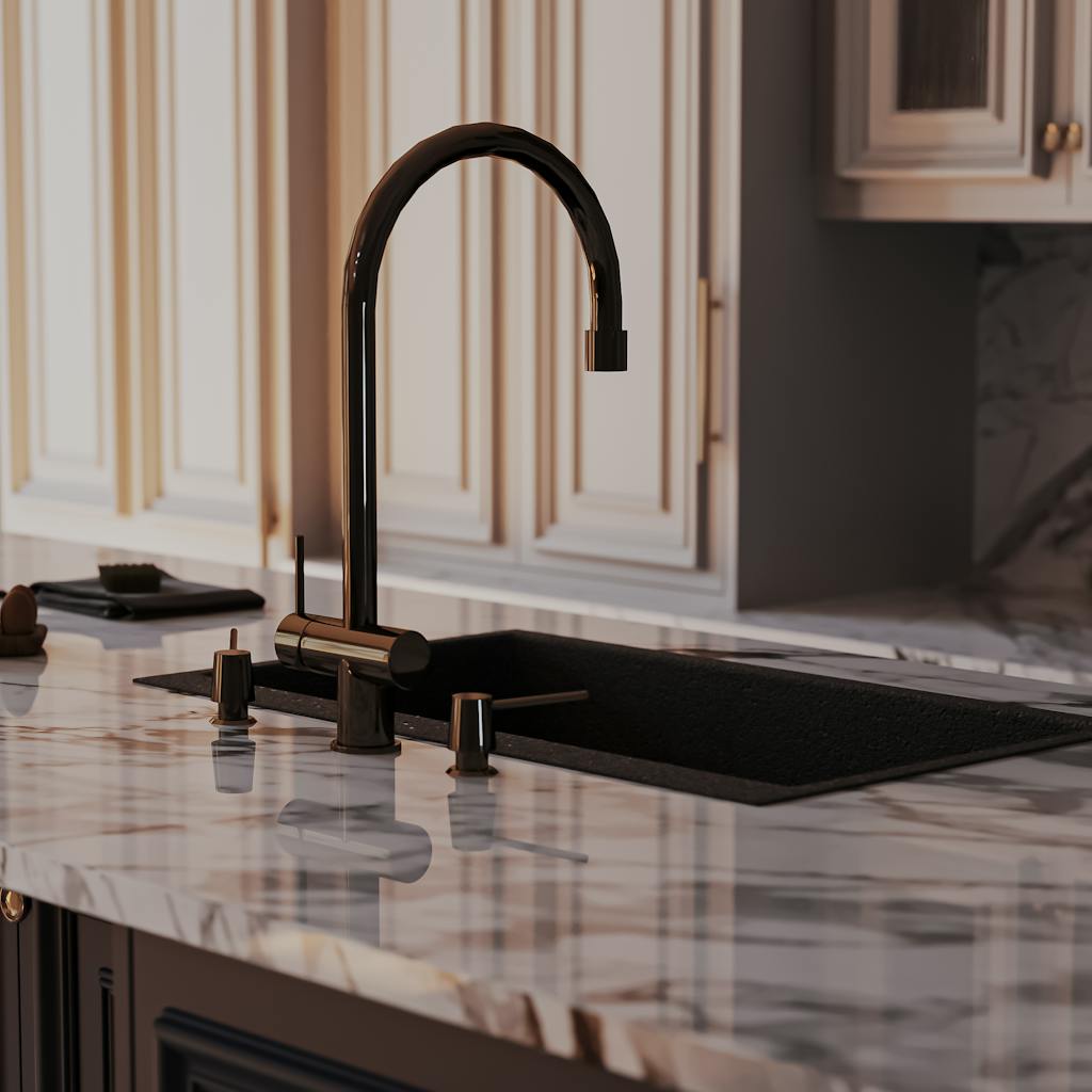Elegant modern kitchen faucet on marble countertop in an upscale Omani interior.